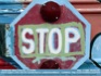 Photo:  Grafitti painted school bus stop sign ©2006 World-Link