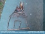 Photo:  A crooked little house - childs stick art on a park bench ©2007 World-Link